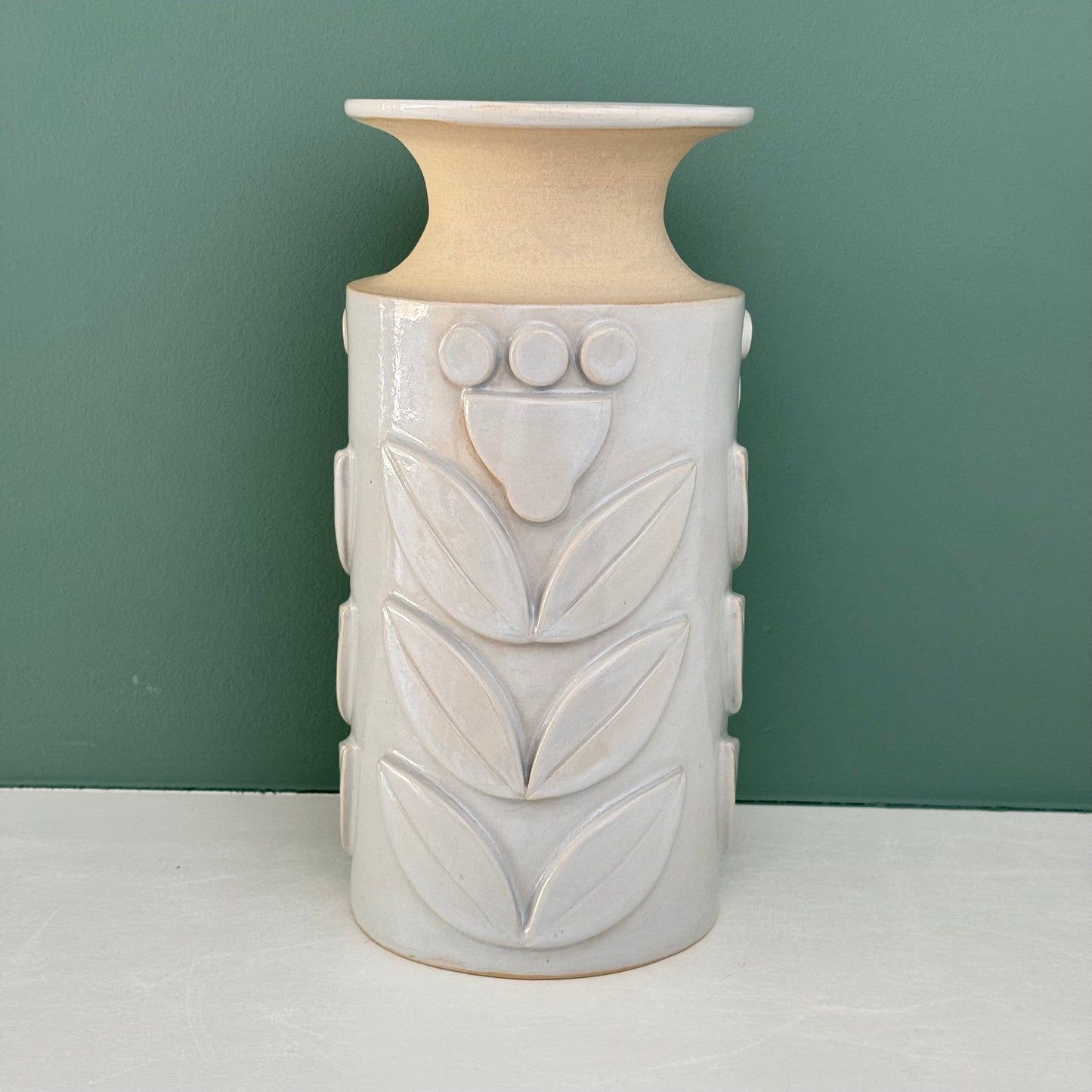 Vase, relief flowers grey