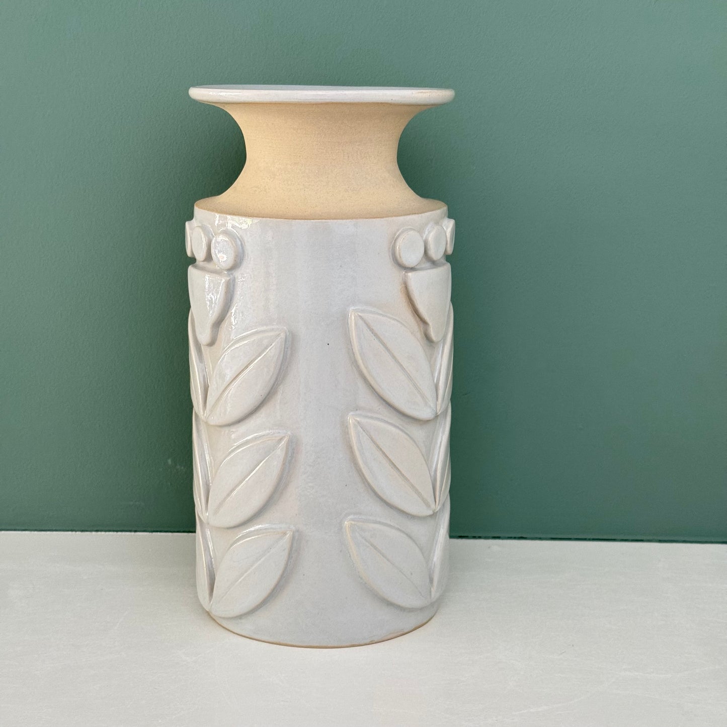 Vase, relief flowers grey