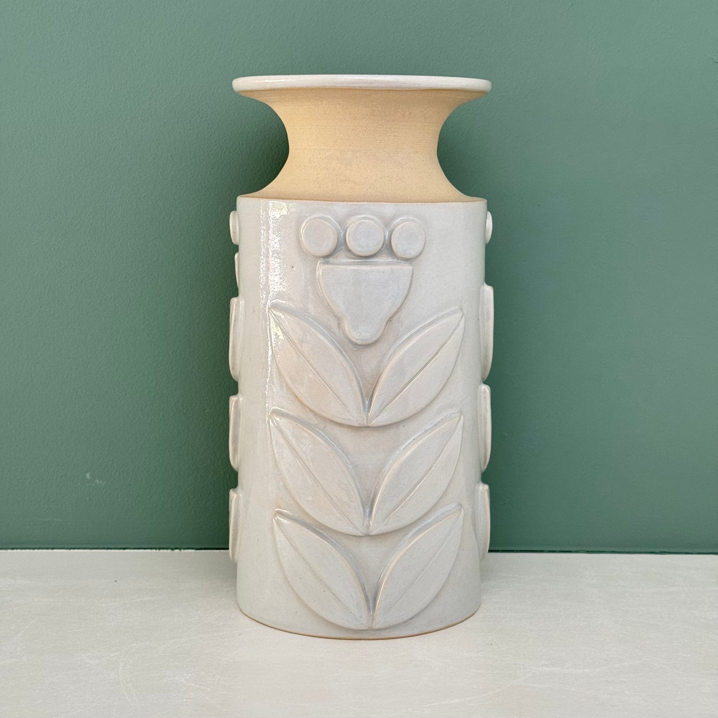 Vase, relief flowers grey