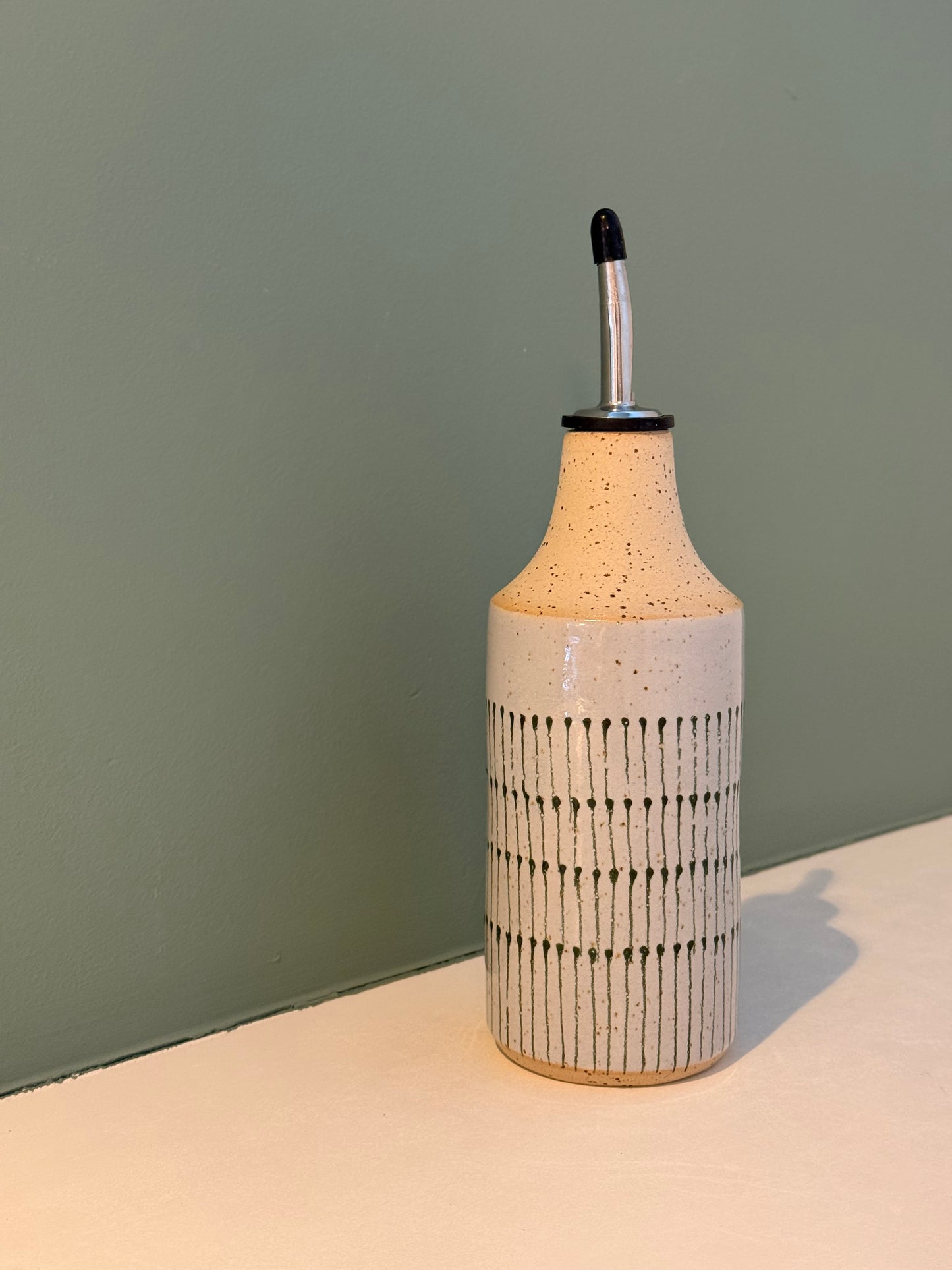 Oil bottle, green teardrops