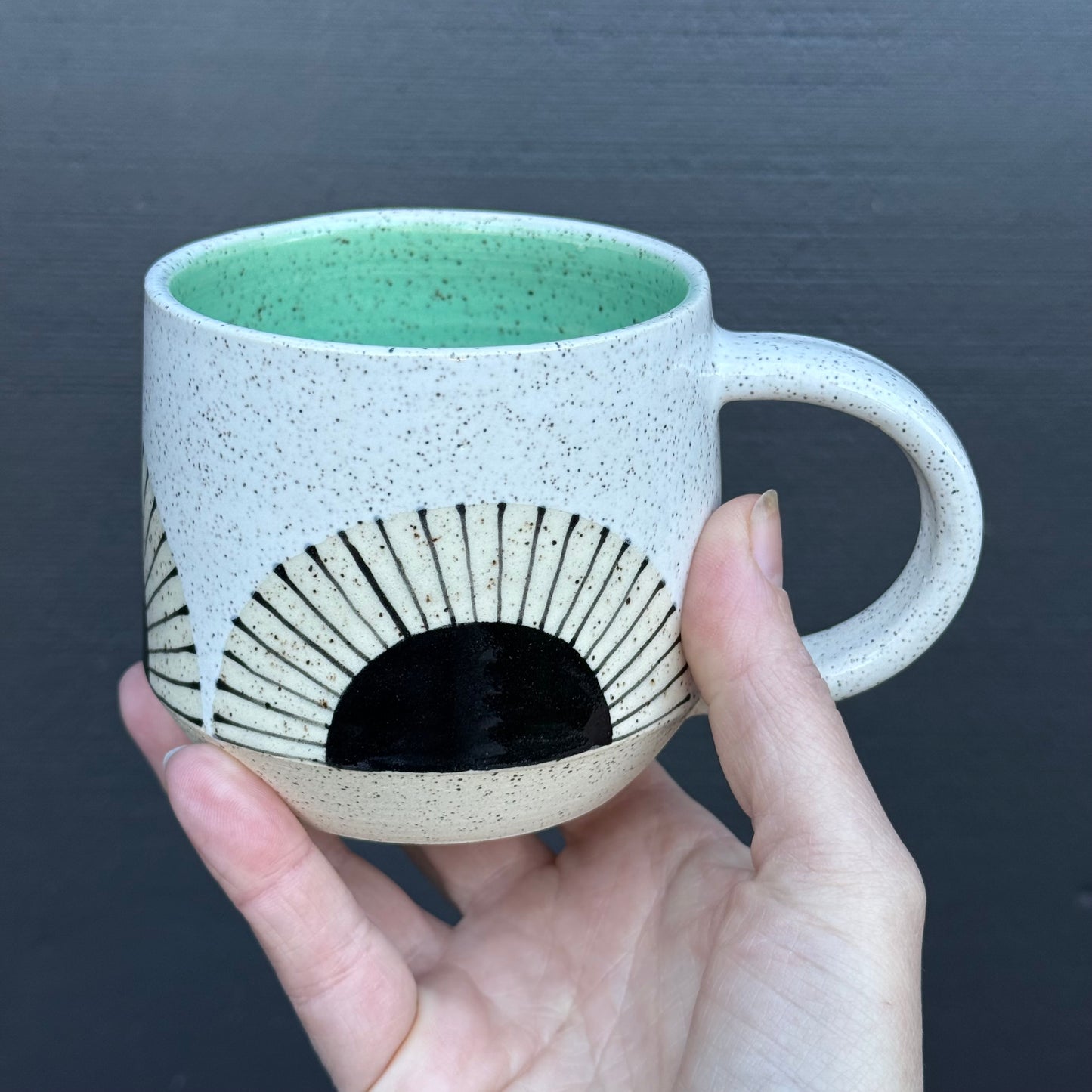 Mug, black sun