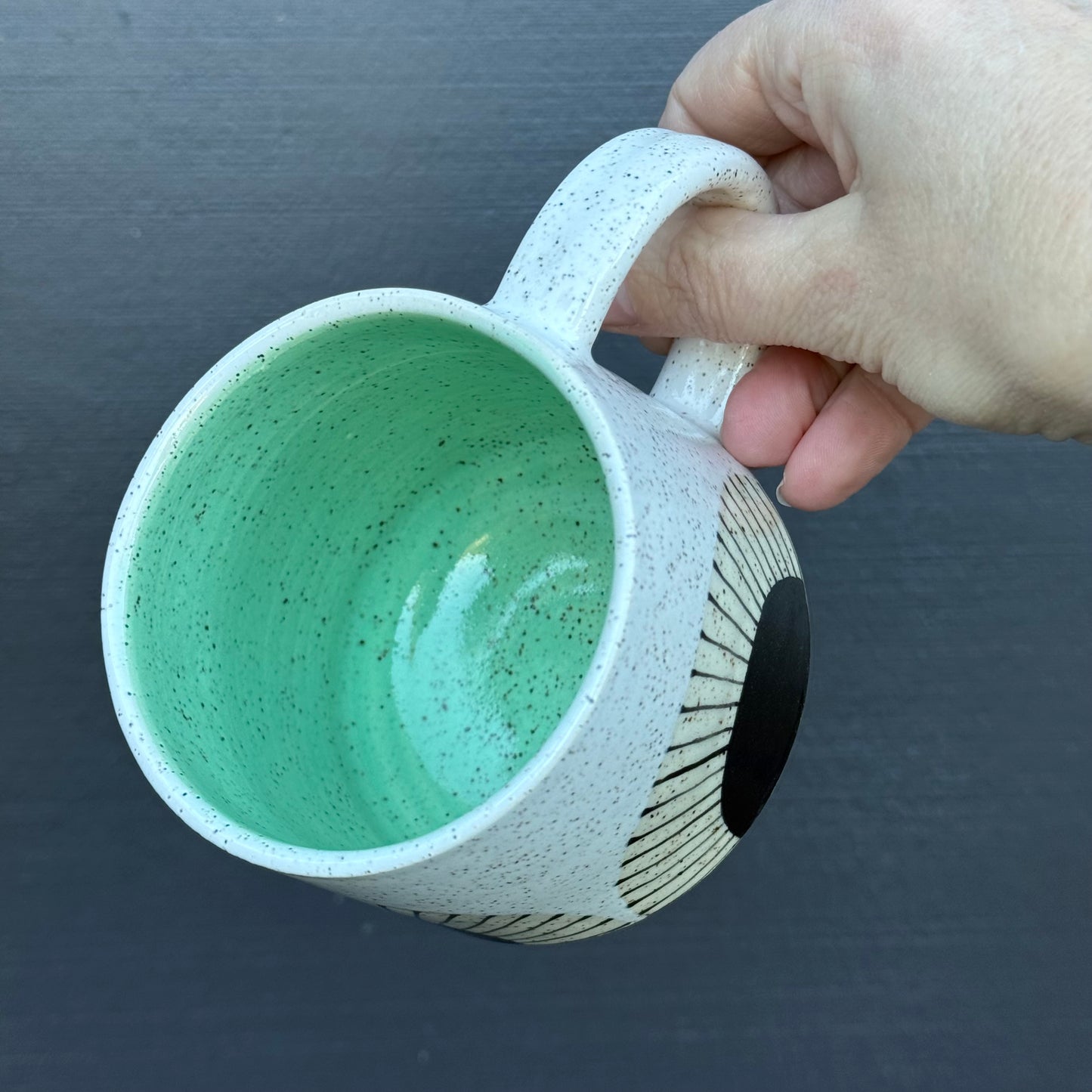 Mug, black sun