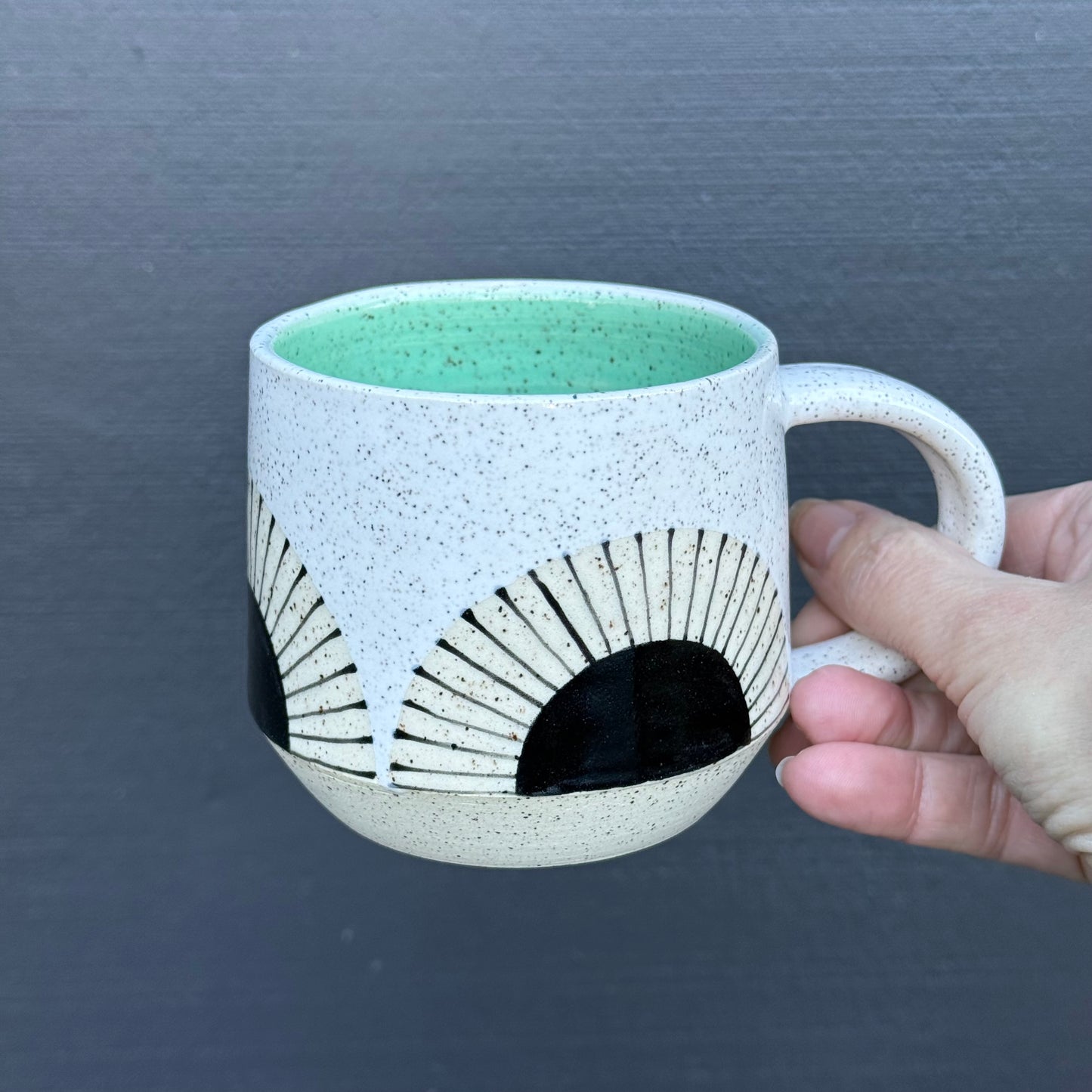 Mug, black sun