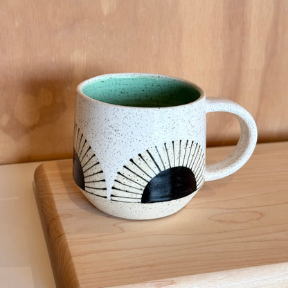Mug, black sun