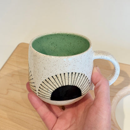 Mug, black sun