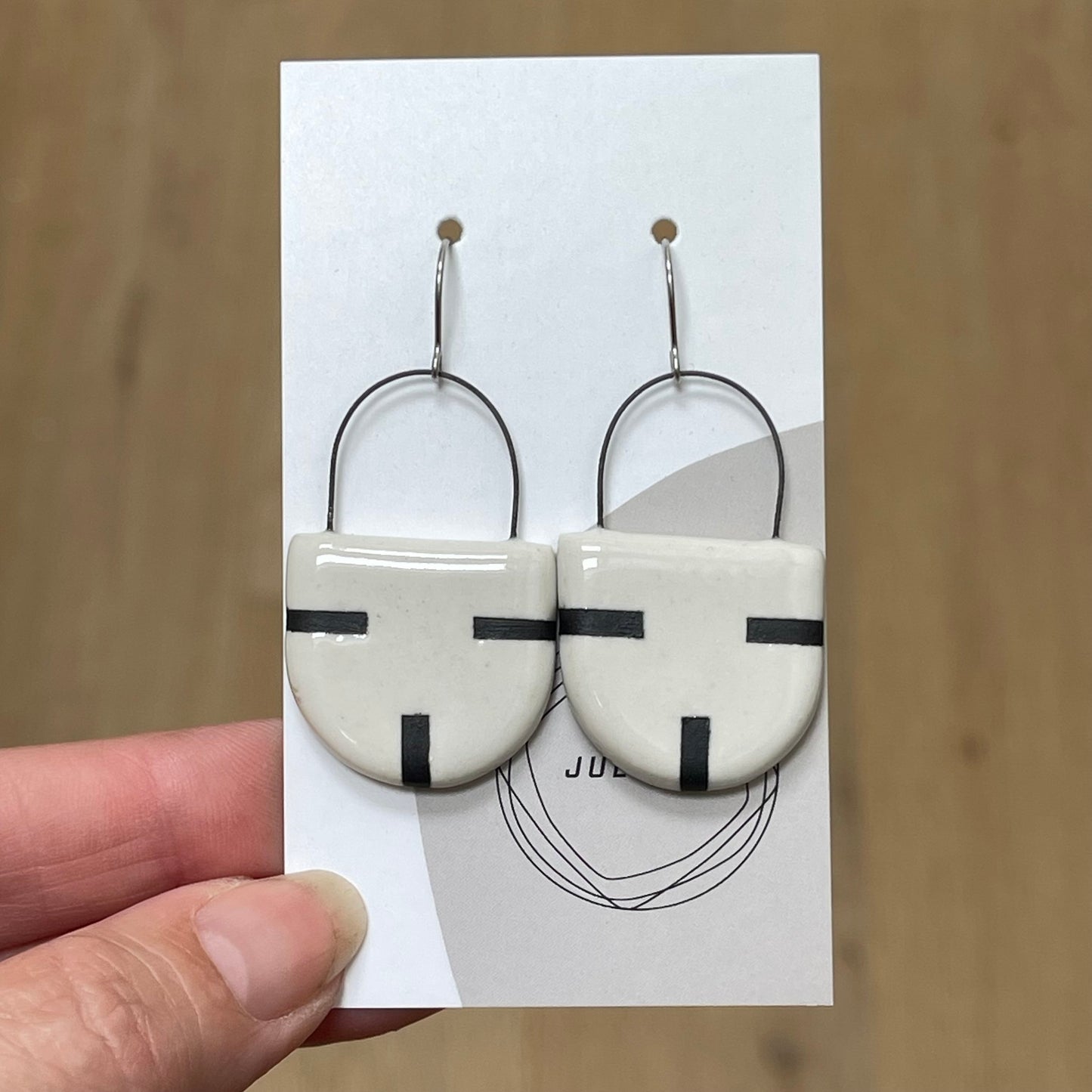 Earrings, solid black lines