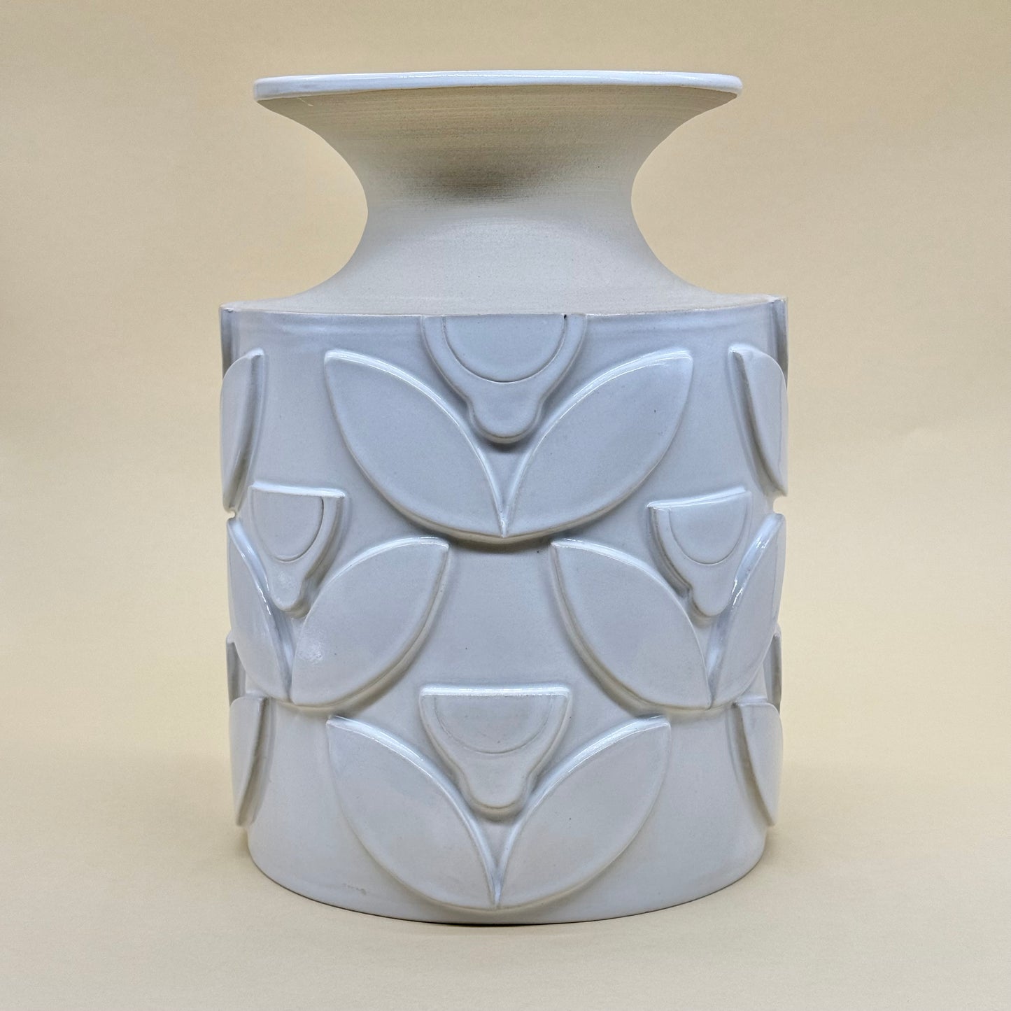 Vase, relief flowers white