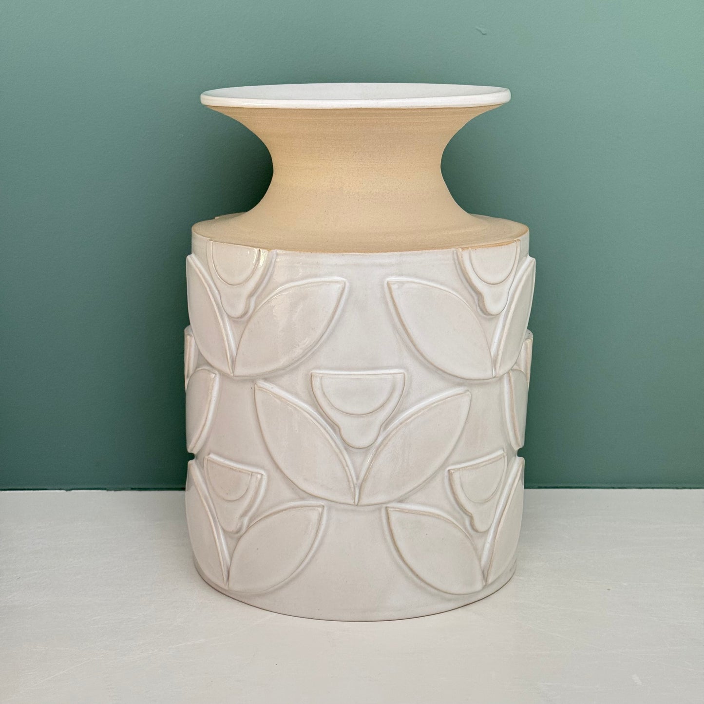 Vase, relief flowers white