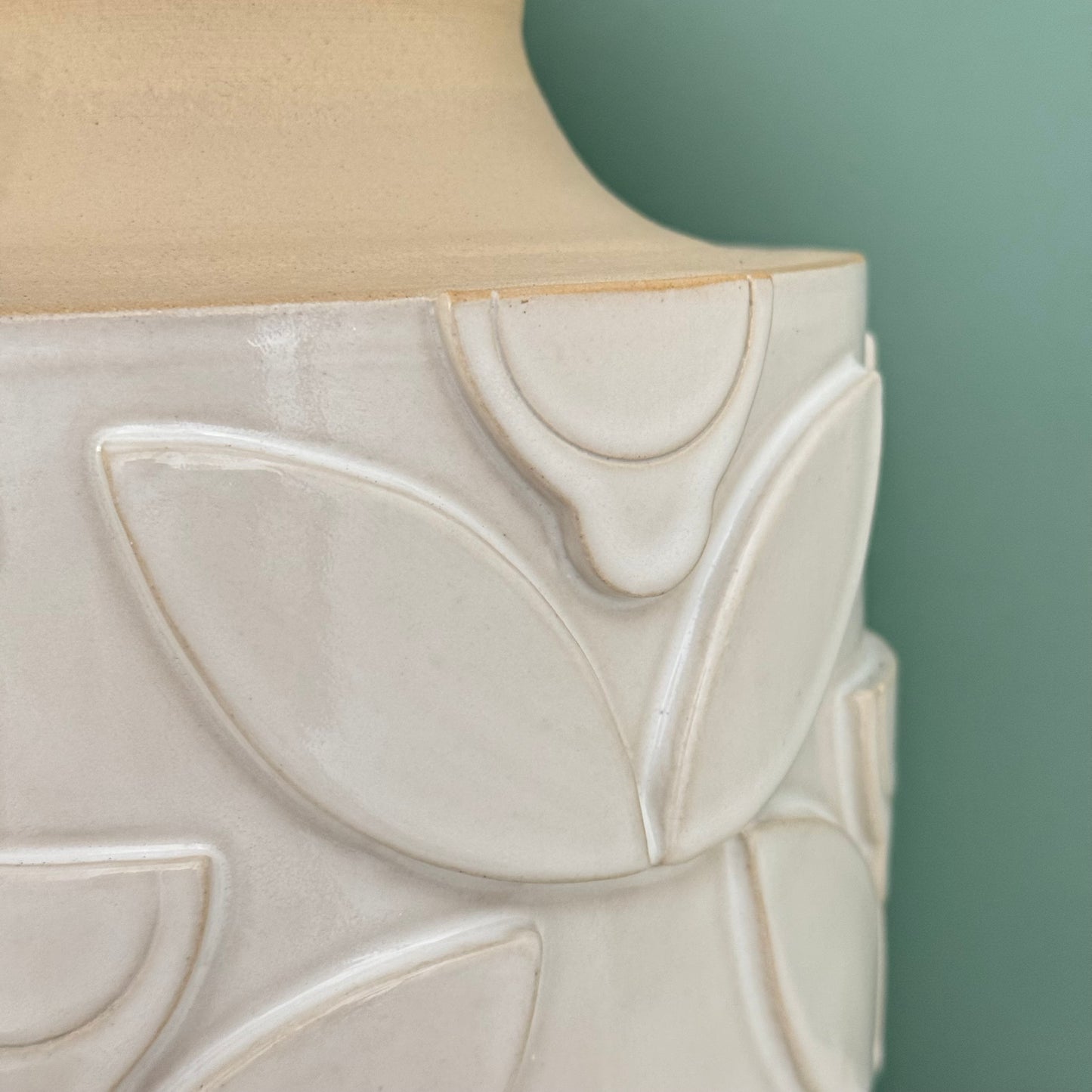 Vase, relief flowers white
