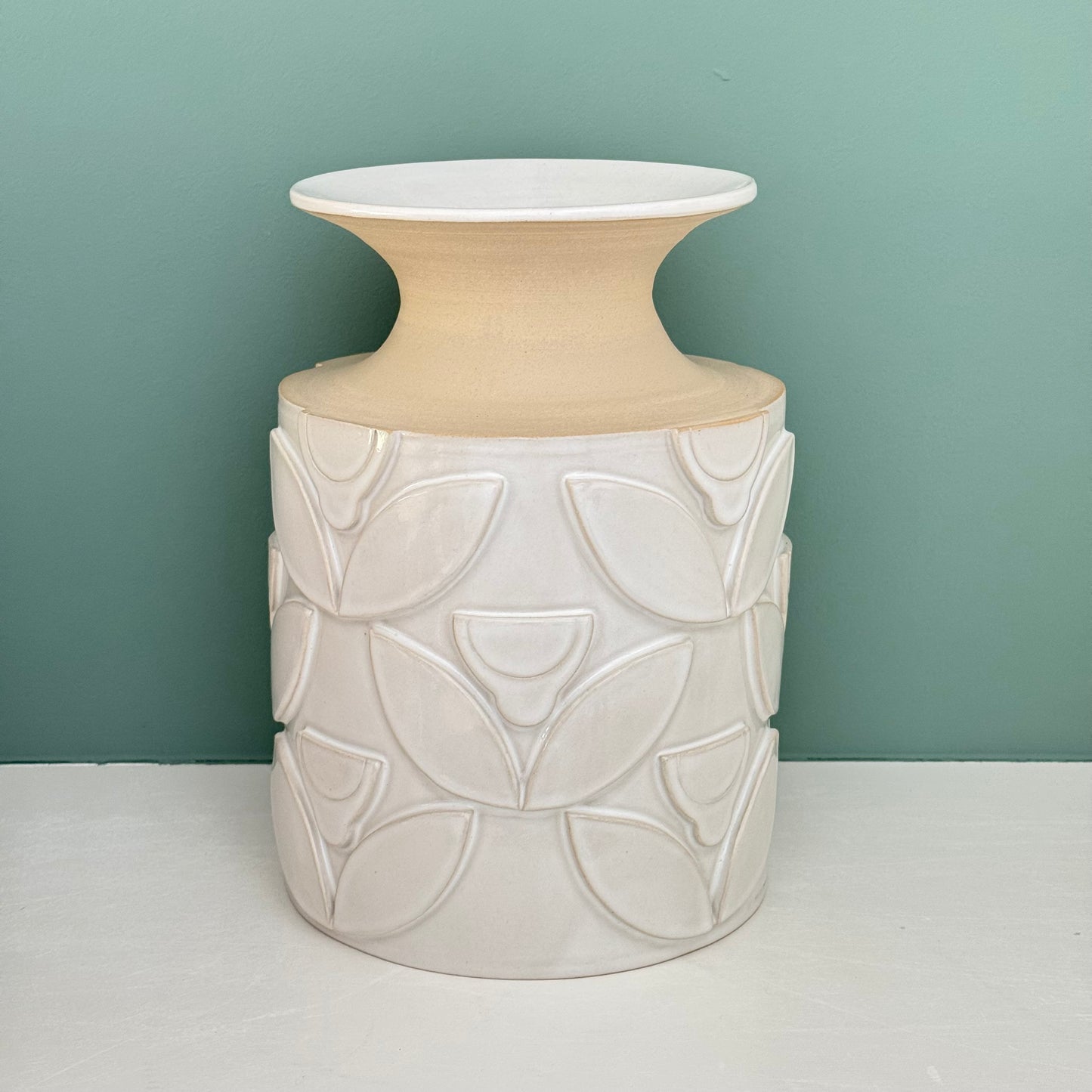 Vase, relief flowers white
