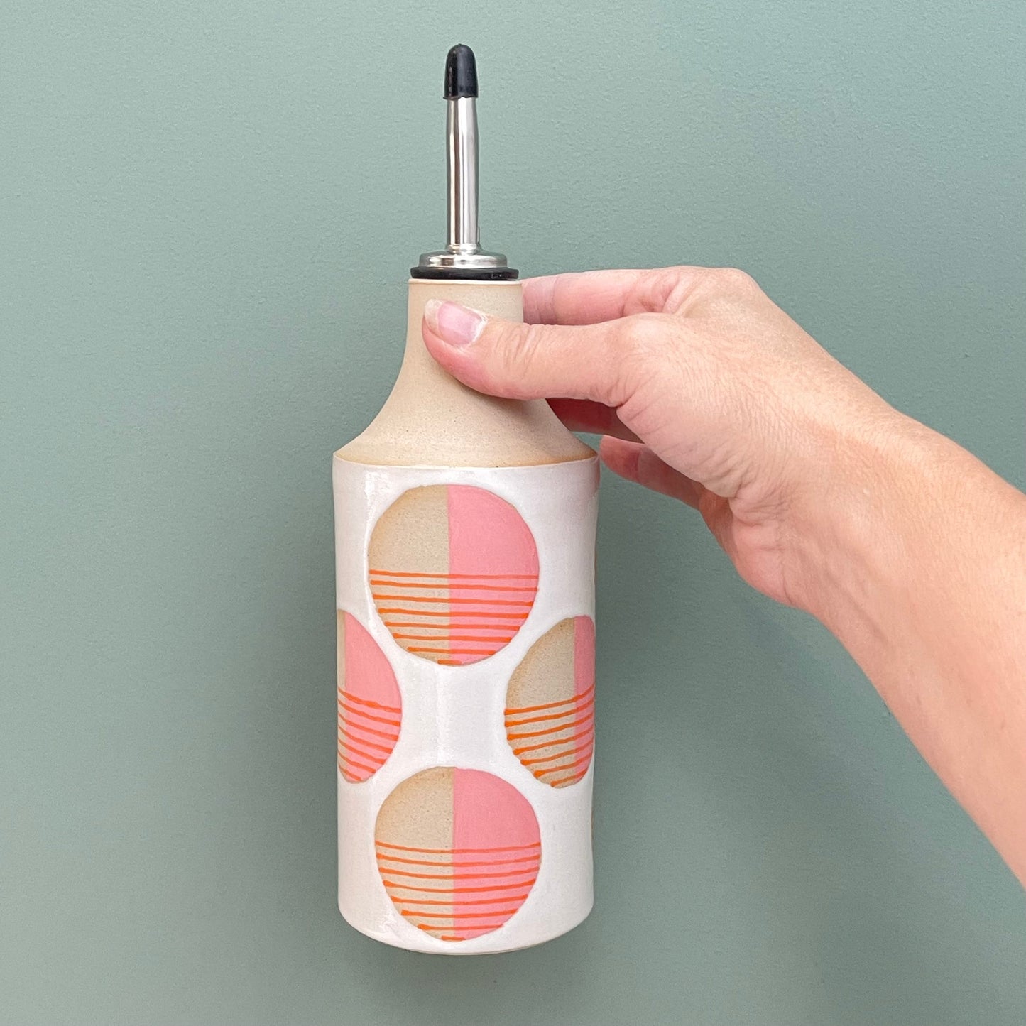 Oil bottle, striped circles pink