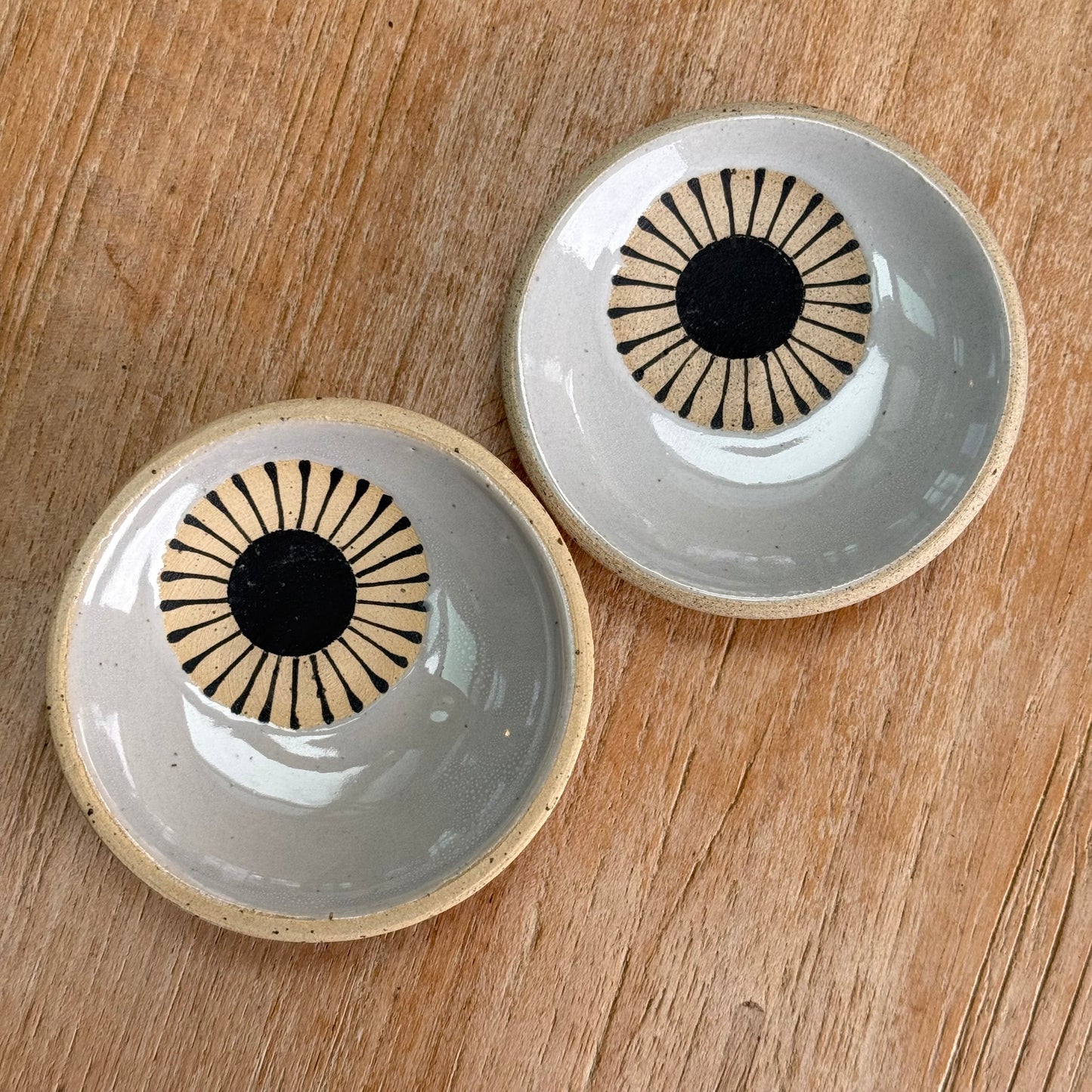 Set of 2 small dishes, black sun/ grey glaze