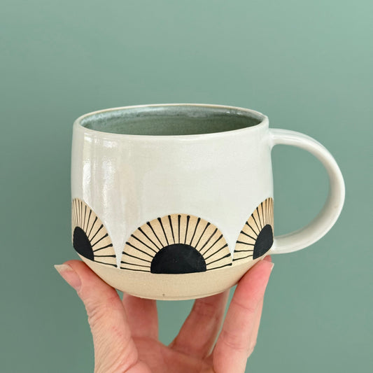 Mug, black sun