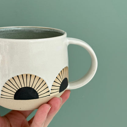 Mug, black sun