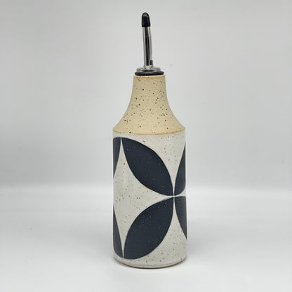 Oil bottle, black leaves